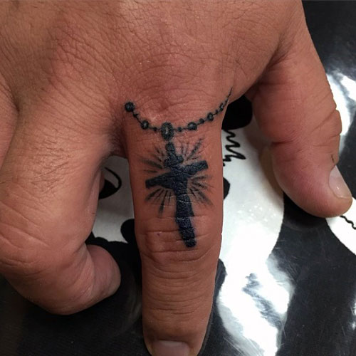Small Cross Finger Tattoo